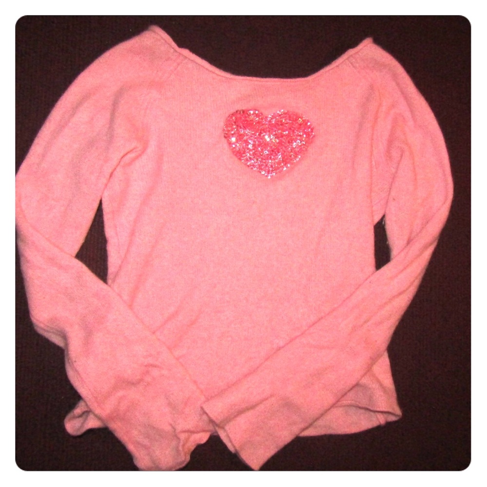 Pink sweater with a heart
